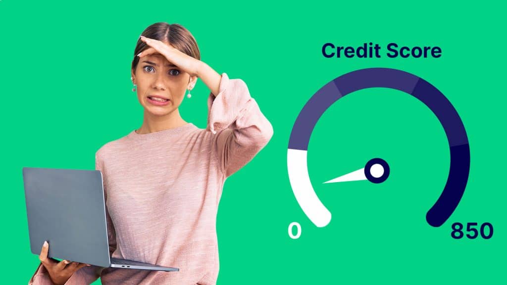 picture of young woman holding a laptop looking unhappy because her credit score low 